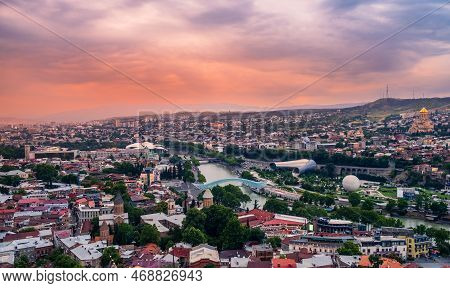 Old Tbilisi Cityscape With Mtkvari Or Kura River, Cathedral, Bridge Of Peace, Rike Park And Presiden
