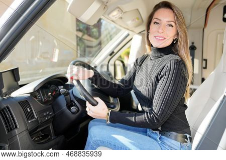 Young Pretty Woman Driving Modern Campervan In Summer Day Vanlife