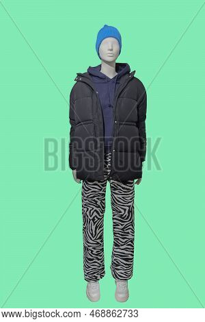 Full Length Image Of A Female Display Mannequin Dressed In Black Quilted Padded Jacket, Hooded Sweat