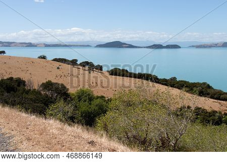 The View Of Picturesque Landscape With Slope, Blue Sea And Mountains On Background In A Sunny Day, D