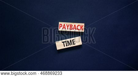 Payback Time Symbol. Concept Words Payback Time On Wooden Blocks. Beautiful Black Table Black Backgr