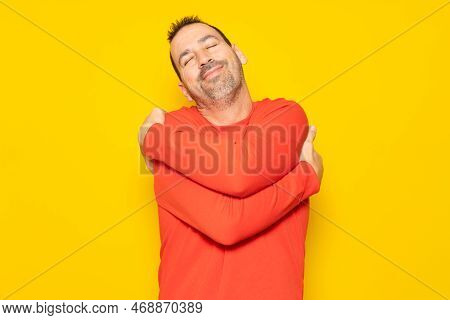 Bearded Hispanic Man Completely Excited And Self-absorbed Hugging Himself Showing He Loves Himself V
