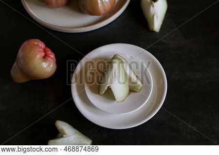 Rose Apple Or Jambu On Dark Background. Thailand Apple Tropical Fruit Flavors Of Sweet Red Gloss.