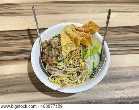 Bowl Mie Ayam Noodles Chicken With Topping Meats And Vegetables With Wooden Table Background Or Text