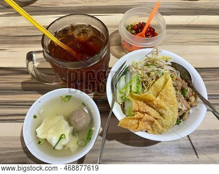 Bowl Mie Ayam Noodles Chicken With Topping Meats And Vegetables With Wooden Table Background Or Text