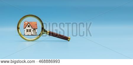 House Under A Magnifying Glass On A Blue Background. Pre-purchase Property Check. Find A Home Or A F