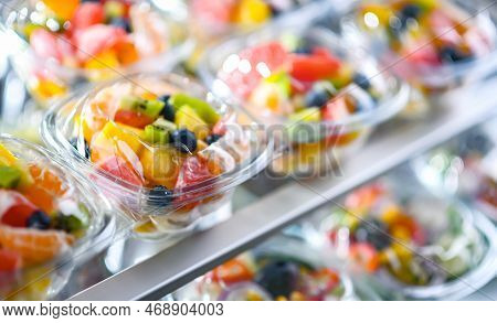 Boxes With Pre-packaged Fruit Salads In A Commercial Fridge