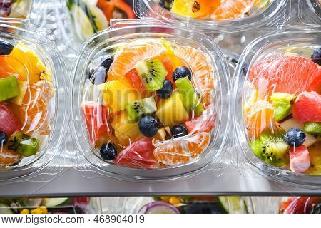 Boxes With Pre-packaged Fruit Salads In A Commercial Fridge