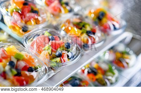 Boxes With Pre-packaged Fruit Salads In A Commercial Fridge