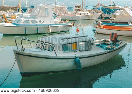 Fishing Dinghy Boats Moored In Small Marina In Town Of Lovran, Croatia. Selective Focus.
