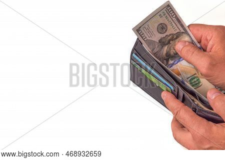 Close Up View Of Wallet With Dollar Banknotes In Man's Hands. Sweden.