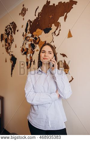 The Travel Agent Keeps Tickets For The Plane In The Travel Agency. She Offers Them To Clients. Coupl