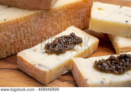 Italian Cheese Collection, Yellow Taleggio Cheese With Black Truffles Mushrooms