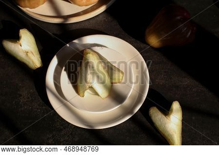 Rose Apple Or Jambu On Dark Background Under Sunlight. Thailand Apple Tropical Fruit Flavors Of Swee