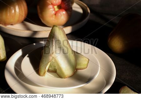 Rose Apple Or Jambu On Dark Background Under Sunlight. Thailand Apple Tropical Fruit Flavors Of Swee