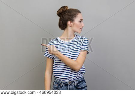 Get Out. Portrait Of Woman Annoyed Young Adult In Striped T-shirt Turning Away And Asking To Leave H