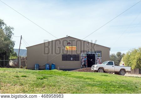 Van Wyksdorp, South Africa - Sep 24, 2022: A Street Scene, With The Twaksak Supermarket, A Person An