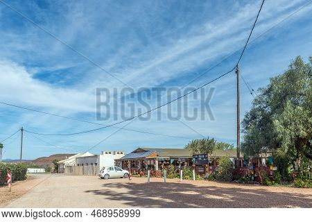 Van Wyksdorp, South Africa - Sep 24, 2022: A Street Scene, With The Van Wyksdorp Mall And A Car, In 