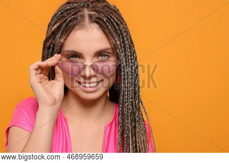 Beautiful Woman With Long African Braids On Yellow Background, Space For Text
