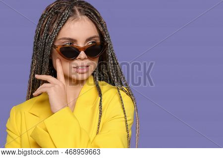 Beautiful Woman With Long African Braids And Sunglasses On Purple Background, Space For Text