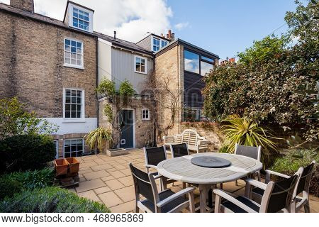Cambridge, England - March 25 2019: Traditional Brick Built Mews Style Terrace House Landscaped Urba