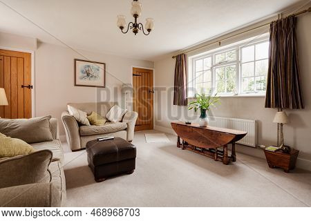 Kennett, Suffolk, England - March 1 2019: Furnished Luxury Living Room With Upholstered Chairs And L