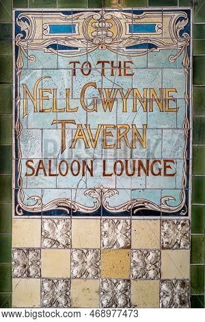 London, Uk - 16 April 2022: The Vintage Tiles Outside Of The Nell Gwynne Tavern In Bull Inn Court, C