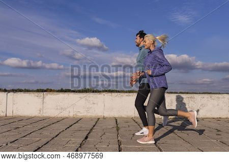 Jogging Concepts. City Running Couple Having Jogging Outside As Runners During Training Outdoor Work