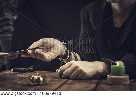 A Fortune Teller Or Oracle Takes Money From A Client For Their Services. Psychic Readings And Clairv