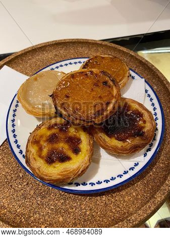 Portuguese Custard Tarts Pasteis De Nata. Pastel De Nata Served With Plate. Traditional Dessert.