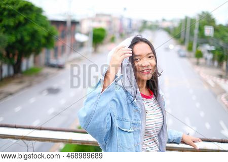 Portrait Happy Young Girl With Beautiful Landscape View At Roiet Thailand.