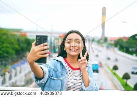 Happy Young Girl Use Mobile Selfi Photo With Landscape View.