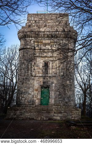 Sobotka, Poland - December 31, 2022: A Stone Tower On The Top Of Wiezyca Mountain In Sleza Massif.