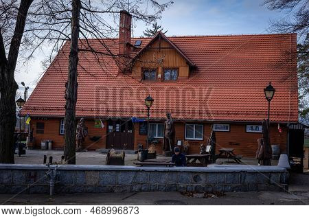 Sobotka, Poland - December 31, 2022: Tourist House And Restaurant Pod Wiezyca. Wooden House With Fol