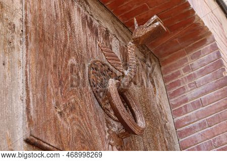 Biar, Alicante, Spain, January 14, 2023: Dragon-shaped Knocker On A Door In Biar, Alicante, Spain