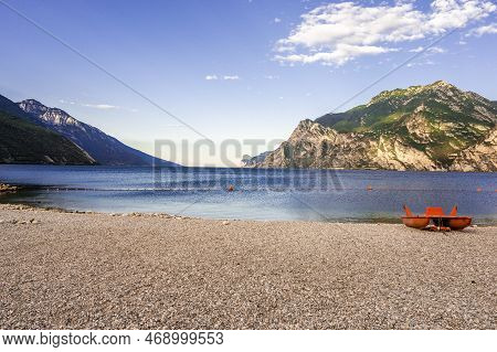 Stone Beach In Italy Without People, North Shore Of The Lake Lago Di Garda Near Torbole, Nago-torbol