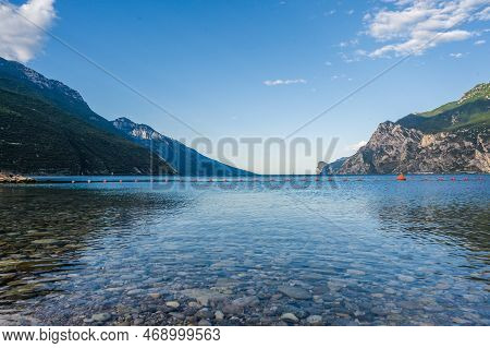 Stone Beach In Italy Without People, North Shore Of The Lake Lago Di Garda Near Torbole, Nago-torbol