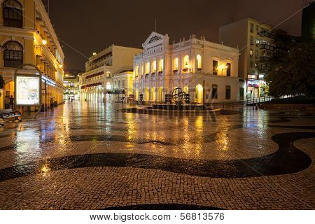 MACAU, CHINA - OCTOBER 30, 2012: Night view in rain on the Historic Centre of Macao - Senado Square. The Historic Centre of Macao was inscribed on the UNESCO World Heritage List in 2005.