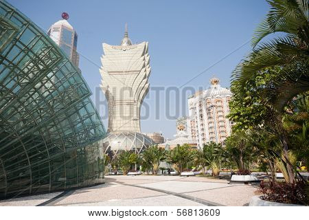 MACAU, CHINA - NOVEMBER 2, 2012: Casinos buildings and Illuminated glass installation in modern area of Macau. Macau is the gambling capital of Asia and is visited by about 29 million tourists year