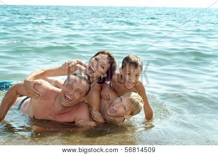 Family swimming in the sea