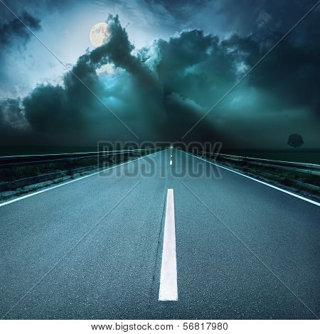 Driving On Asphalt Road Towards  Oncoming Stormy Night