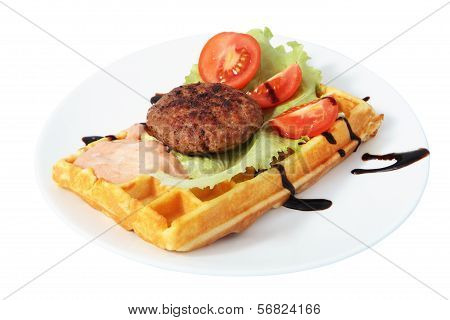 Belgian Waffle With Beefsteak, Tomato Slices, Lettuce Leaf And Sauce.