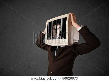 Business man with monitor screen on his head traped into a digital system concept