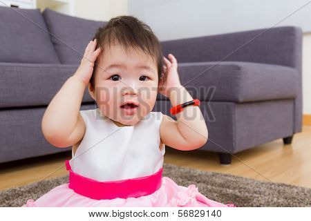 Little girl hand cover ear