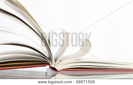 Close up on heart shaped book pages 