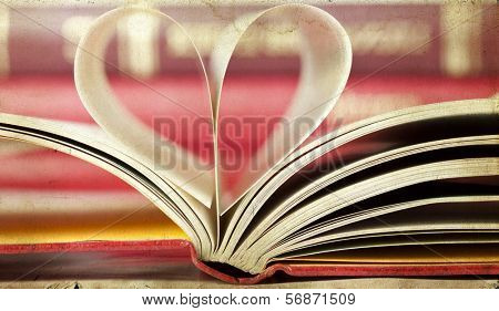 Vintage photo of heart shaped book pages                                