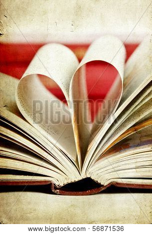 Vintage photo of heart shaped book pages                                
