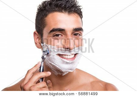 Man Shaving His Face