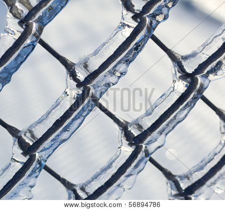 Ice coated chain link fence from an ice storm