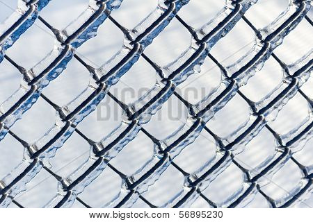 Ice coated chain link fence from an ice storm